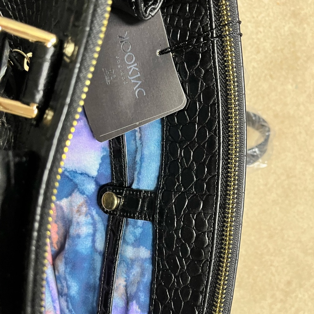 Kookjac embossed leather purse. New with tags and all original packaging.